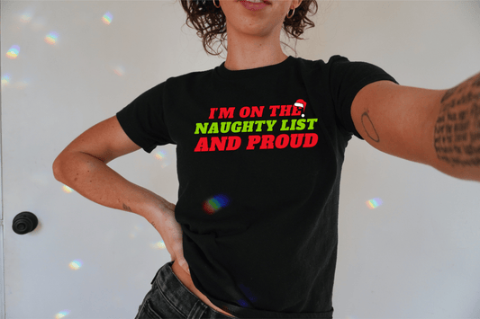 I'm on the Naughty List and Proud Christmas Baby Tee